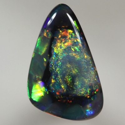 SOLID BLACK OPAL  Unusual pattern, nubular centre surrounded by rolling flashes